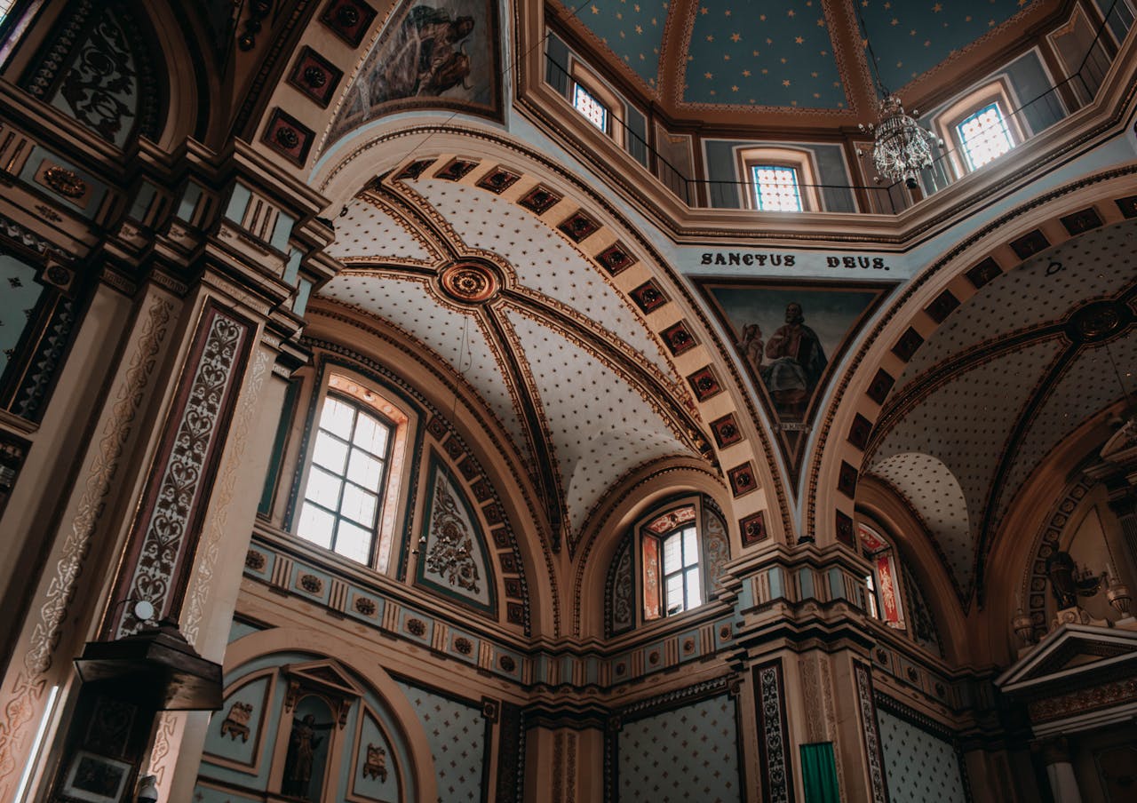Explore the stunning architecture of a historic church in Real de Catorce, Mexico, showcasing intricate arched ceilings.